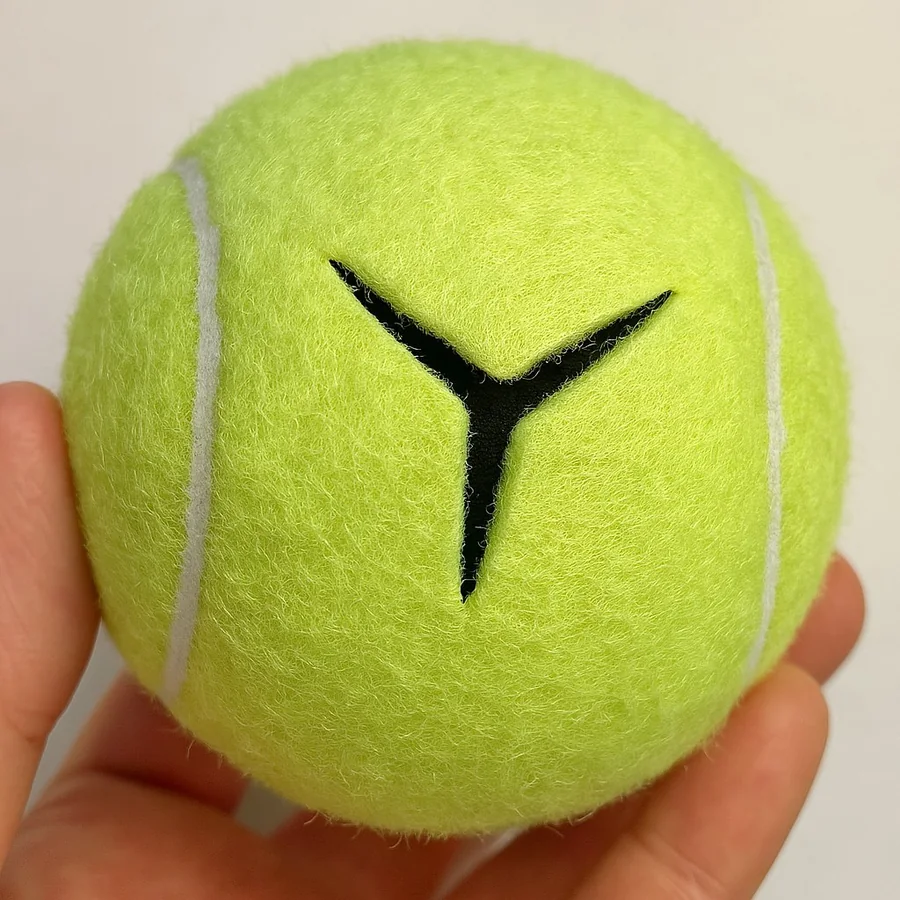 Close-up of recycled precut tennis ball with Y-shaped cut